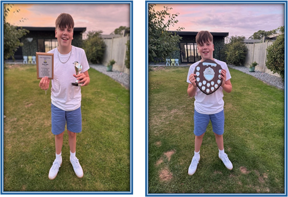 student with his trophies