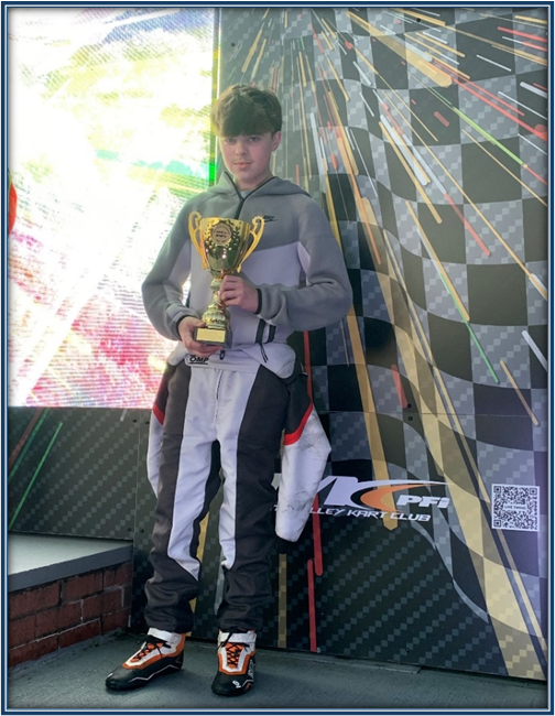 student holding a trophy